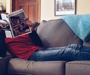 relaxing on couch with magazine